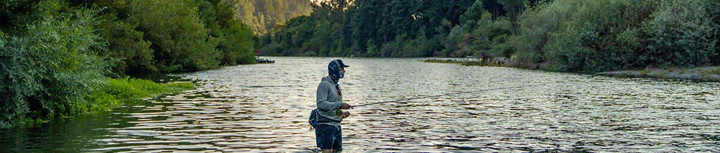 A fly fisherman using a Buff on the water.