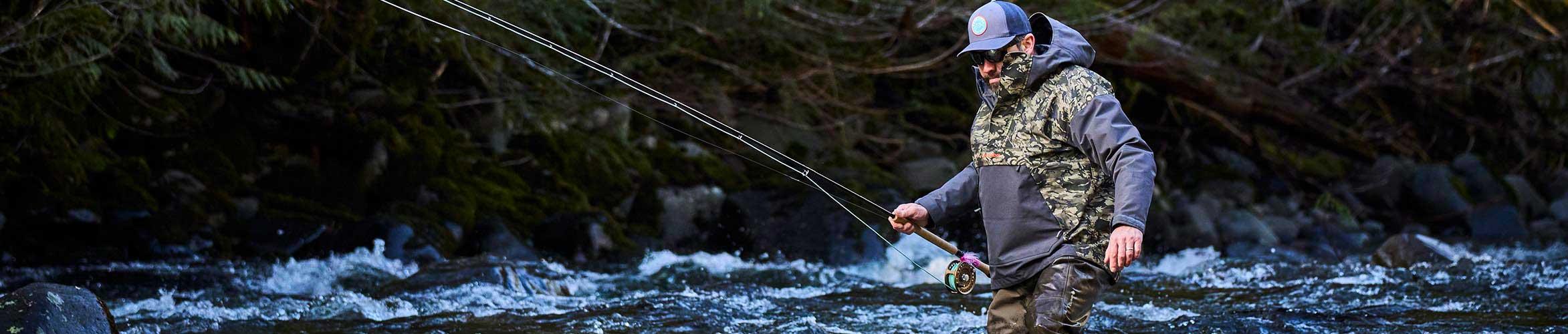 An angler wades a river in Oregon in search of steelhead while using the NEW Grundens Boundary Series Waders