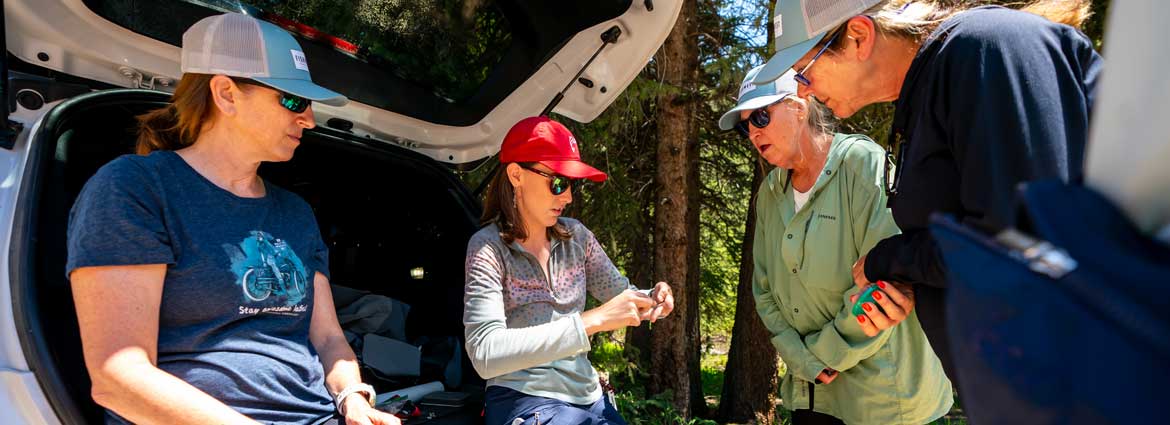 Fishwest Instructor, Holly Jones gives a knot tying demonstration during a class session along the Mirror Lake Highway in the Uinta National Forest.