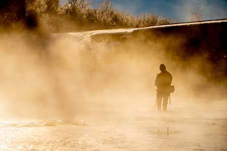 Fishwest employee JC Weeks fishes the Weber River on a misty winter morning.