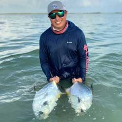 Fishwest Pro, Alan Beltran with two permit caught on the flats surrounding Xcalak Mexico while guiding for the X-Flats lodge.