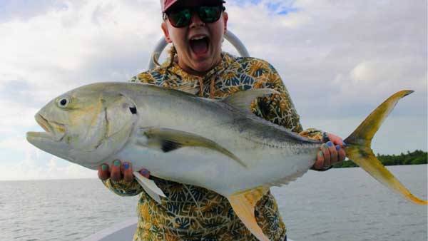 A happy angler with a monster Jack Crevalle caught on the flats surrounding Xcalak, Mexico