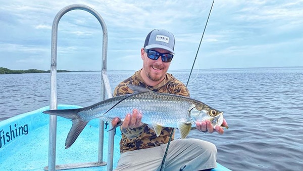 Fishwest's own JC showing off a nice Baby Tarpon caught at the TCL.
