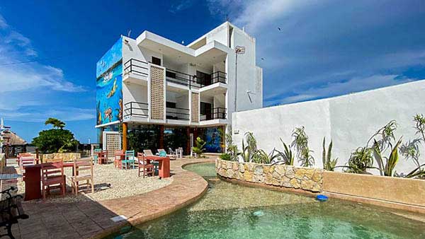 Poolside views at the hotel Yuum Ha, the home of the Tarpon Cay Lodge.