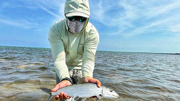 An angler showcasing one of the many beautiful bonefish (macabi) on the flats surrounding Xcalak. A great target for those anglers who do not wish to chase permit.