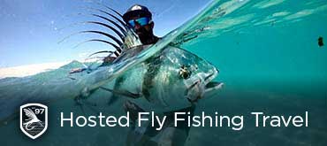 An angler admires a beautiful Roosterfish off the beach caught on a Fishwest Hosted Trip to Baja Mexico in 2021.